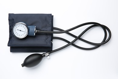 Photo of Blood pressure measuring device on light background, top view