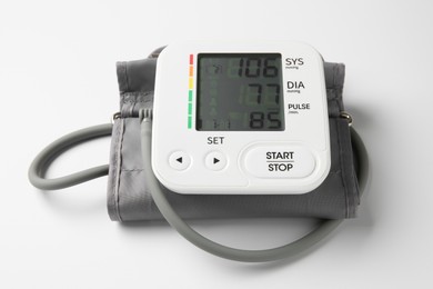 Photo of Blood pressure measuring device on white background, closeup