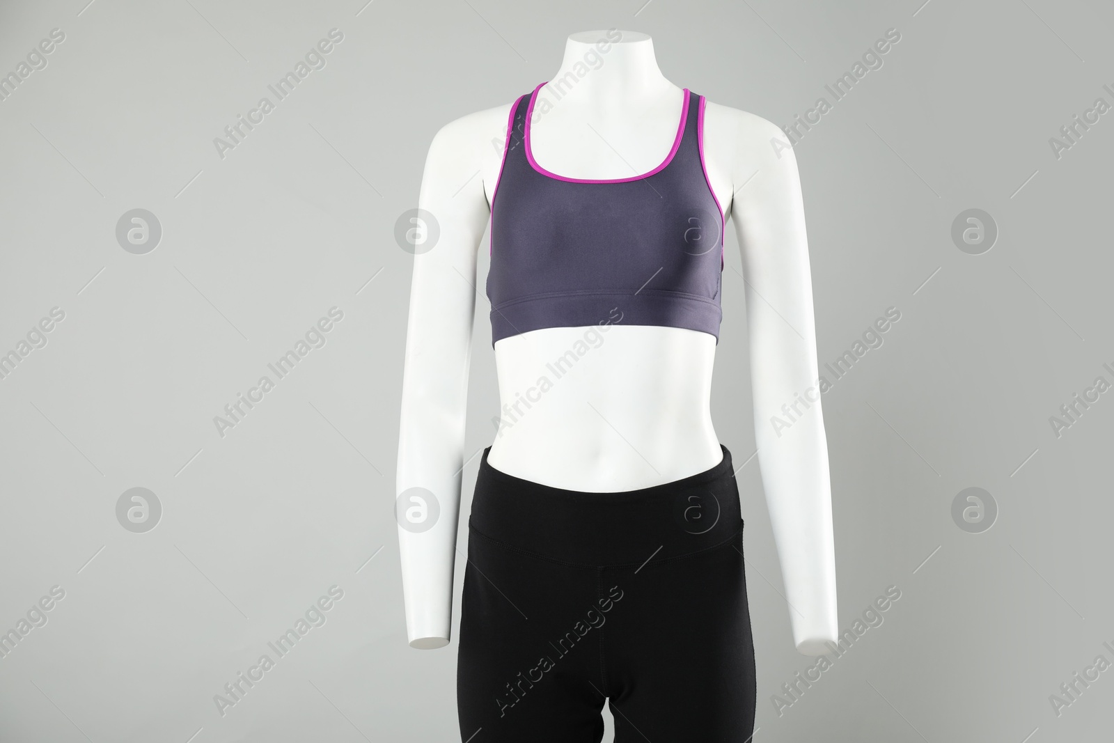 Photo of Female mannequin with stylish sportswear on light background