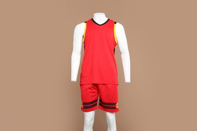 Photo of Male mannequin with stylish sportswear on beige background