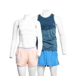 Photo of Female and male mannequins with stylish sportswear on light background