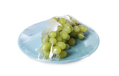 Plate of fresh grapes with plastic food wrap isolated on white