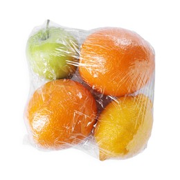 Fresh fruits with plastic food wrap isolated on white, top view