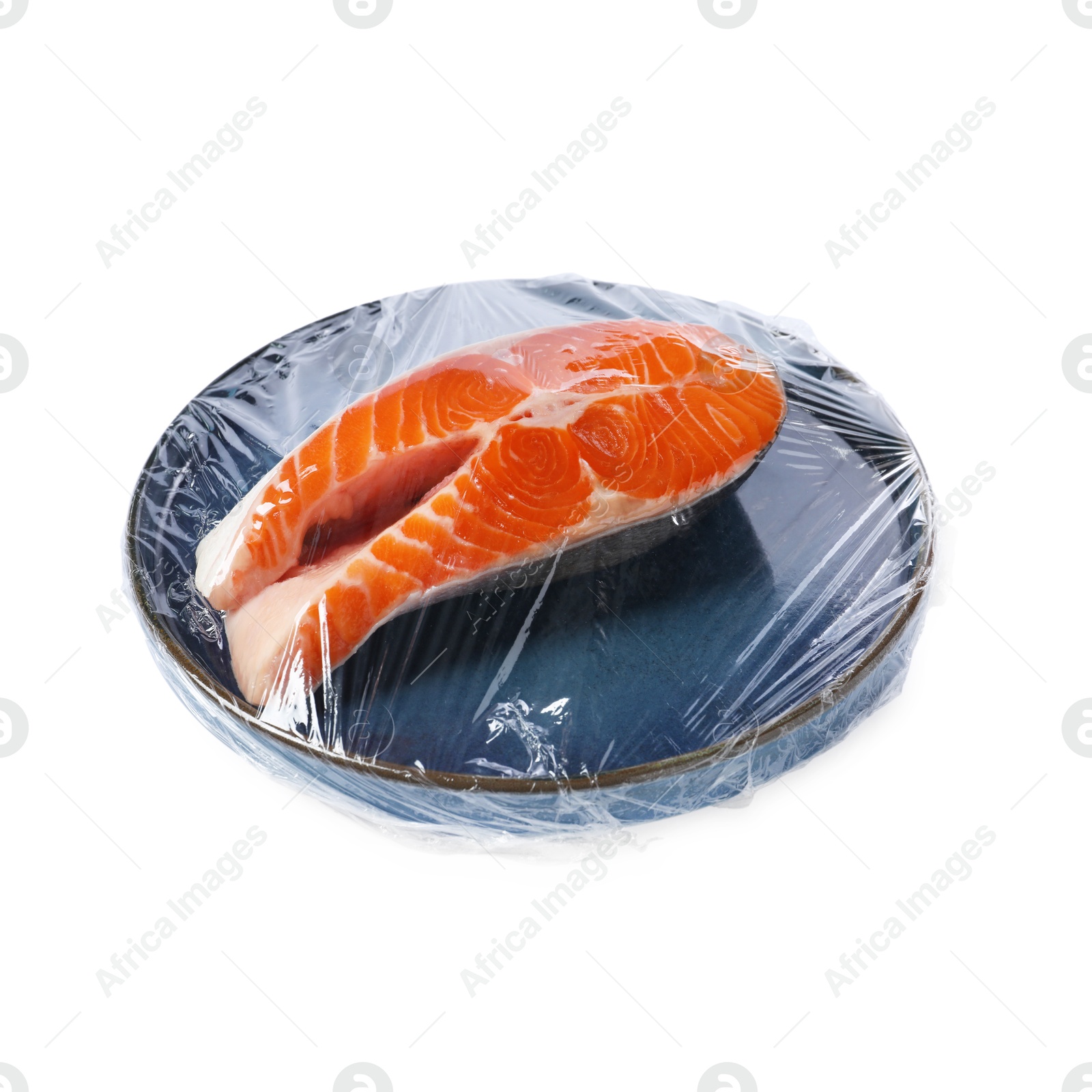 Photo of Plate of salmon with plastic food wrap isolated on white