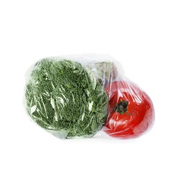 Photo of Green broccoli and tomato with plastic food wrap isolated on white