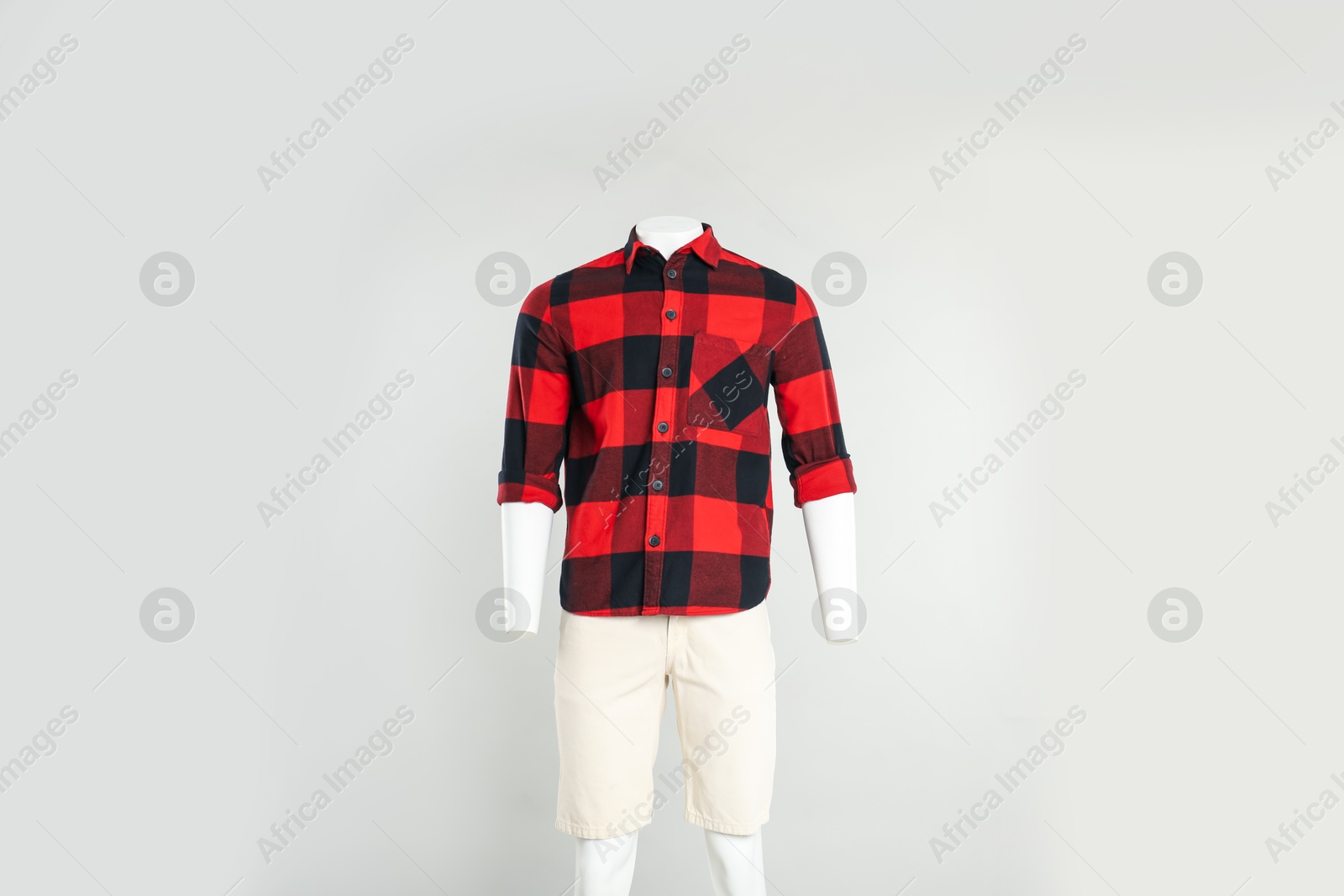 Photo of Male mannequin with stylish outfit on light grey background