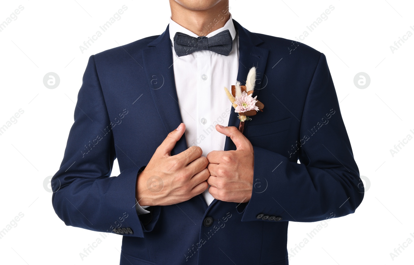 Photo of Groom in suit with stylish boutonniere on white background, closeup