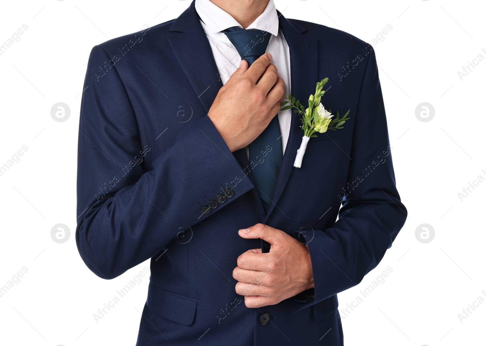 Photo of Groom in suit with stylish boutonniere on white background, closeup