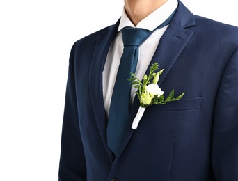 Groom in suit with stylish boutonniere on white background, closeup