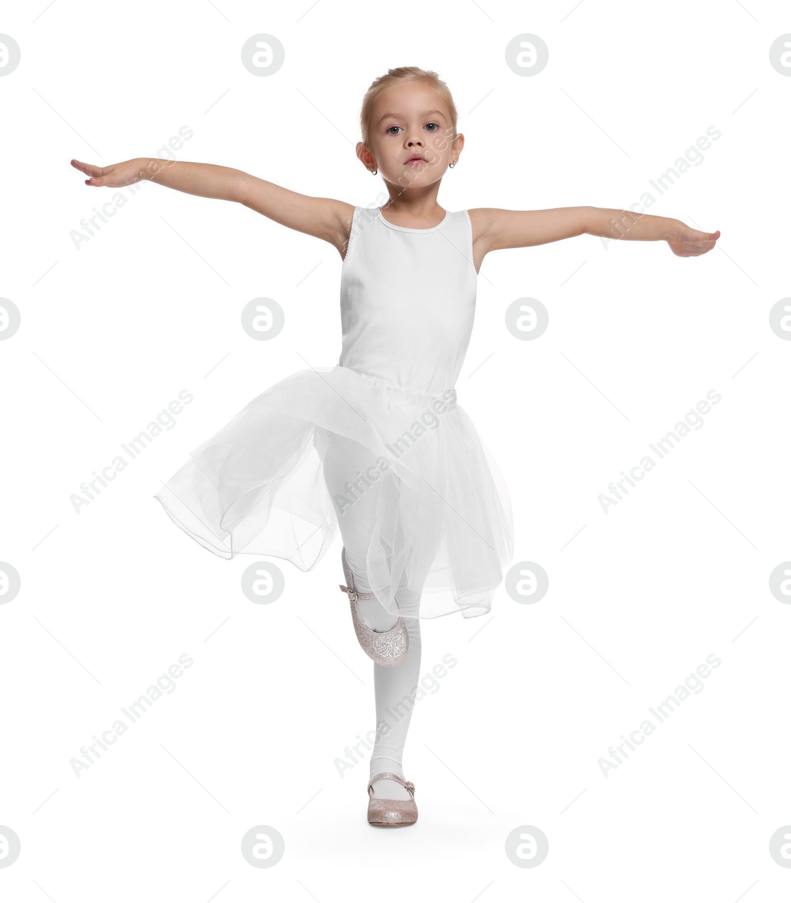 Photo of Little girl pretending to be ballerina on white background. Dreaming of future profession