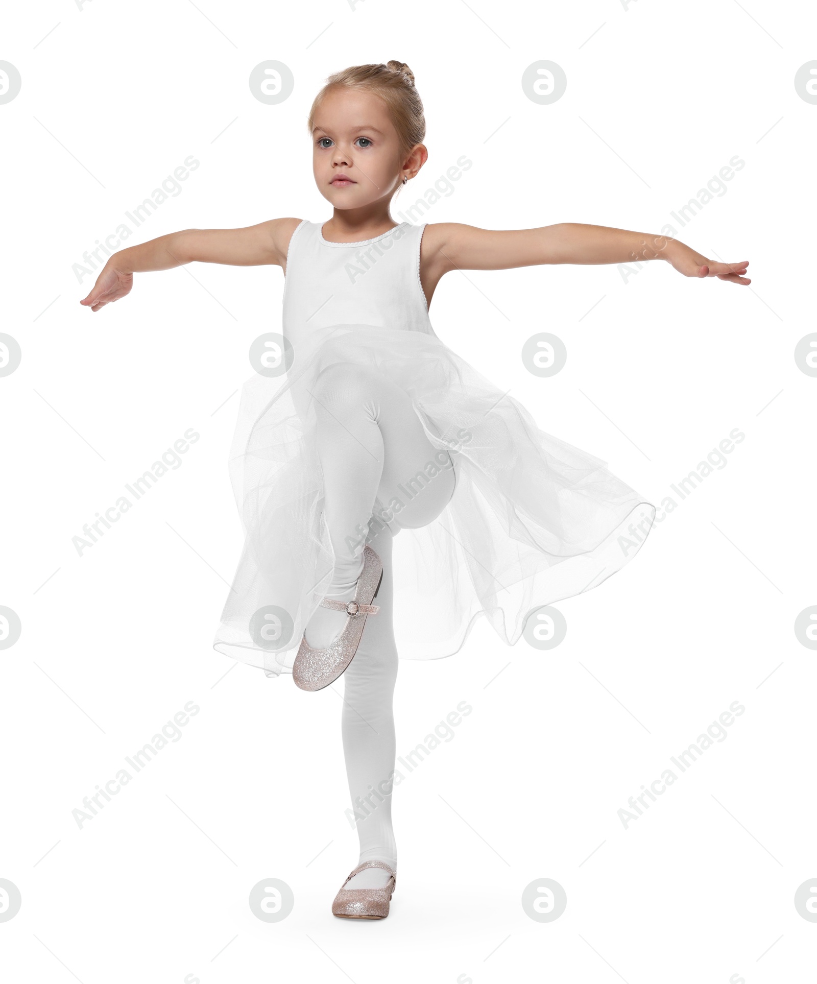 Photo of Little girl pretending to be ballerina on white background. Dreaming of future profession