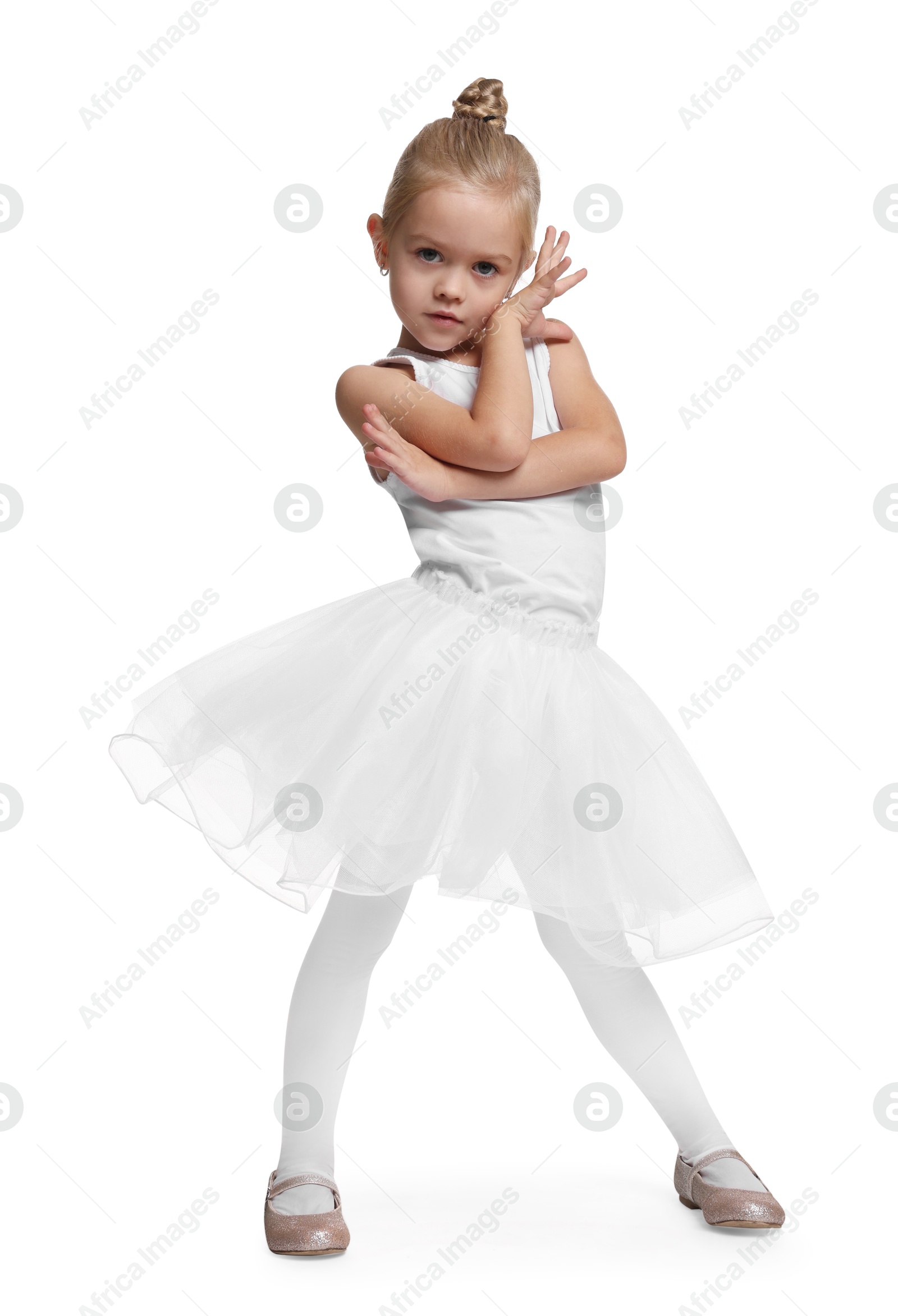 Photo of Little girl pretending to be ballerina on white background. Dreaming of future profession