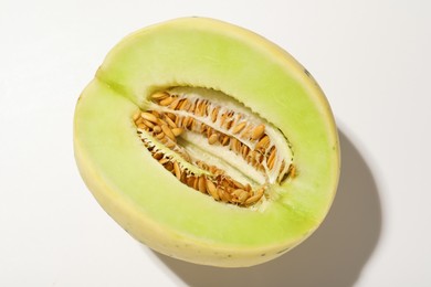 Photo of Cut fresh ripe honeydew melon on white background, closeup