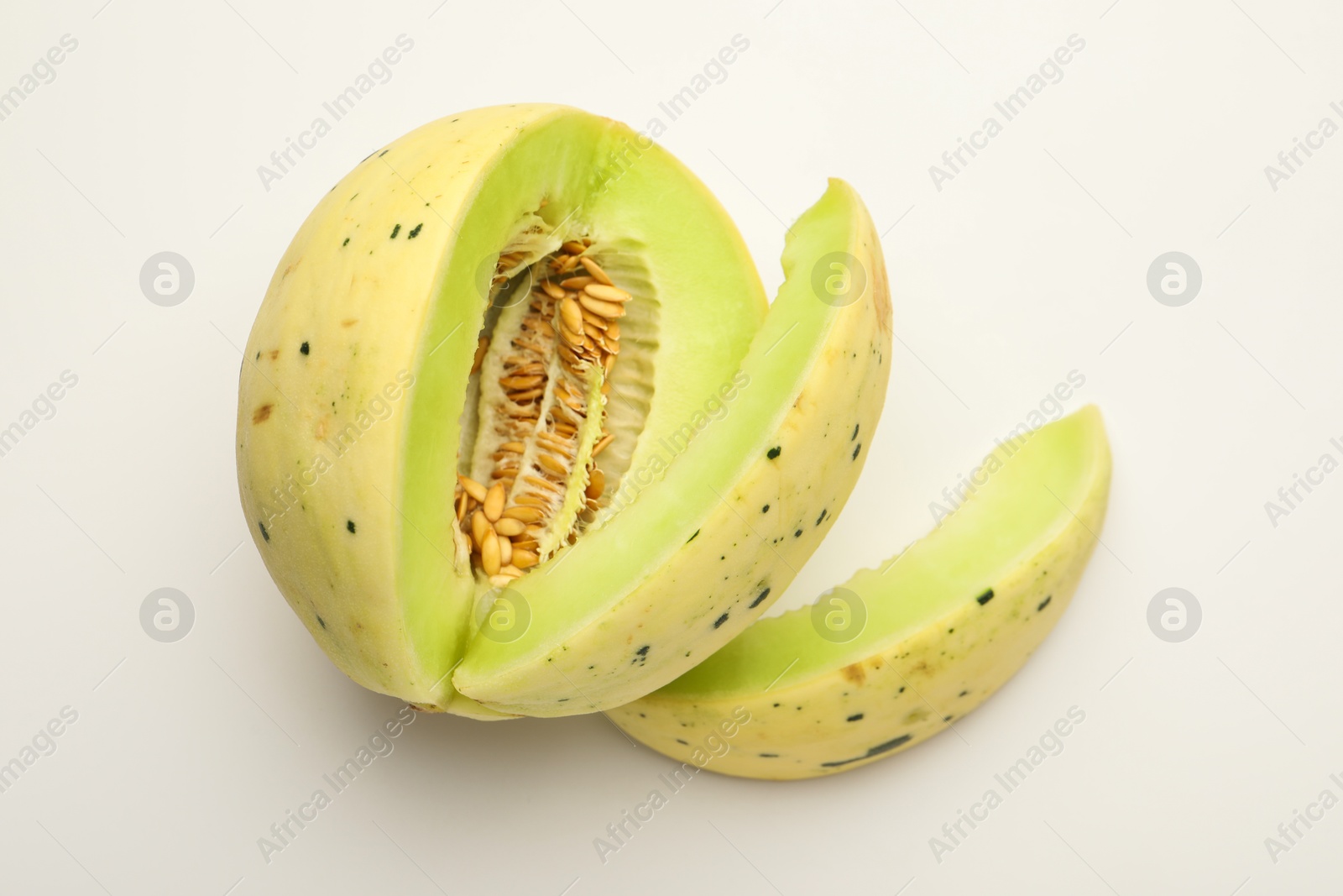 Photo of Cut fresh ripe honeydew melon on white background