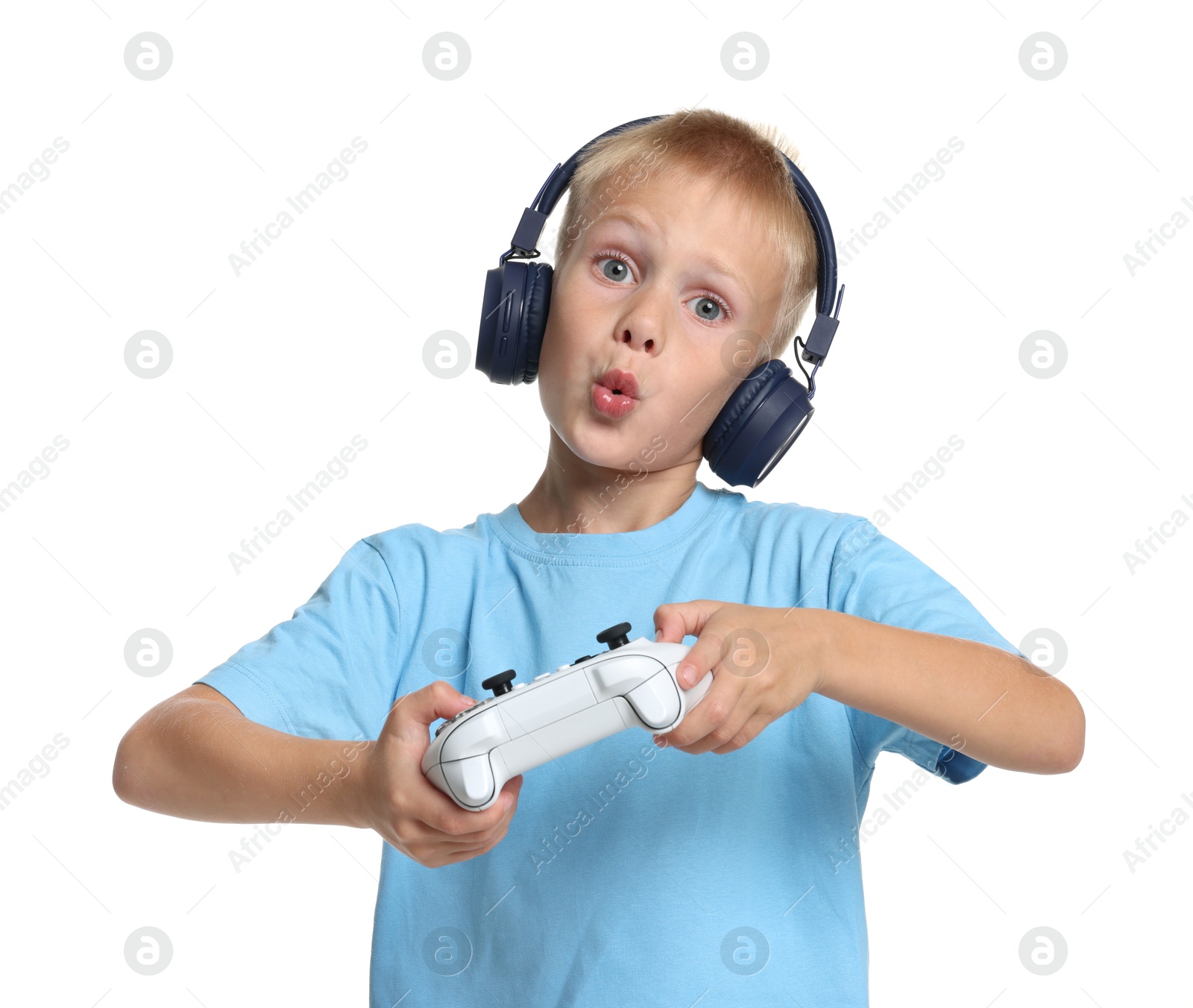 Photo of Cute little boy in headphones playing video game with controller on white background