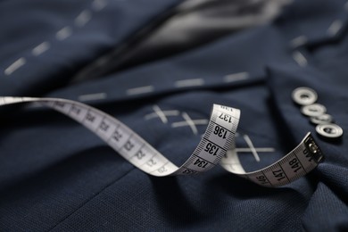 Elegant semi-ready jacket and measuring tape, closeup