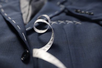 Elegant semi-ready jacket and measuring tape, closeup