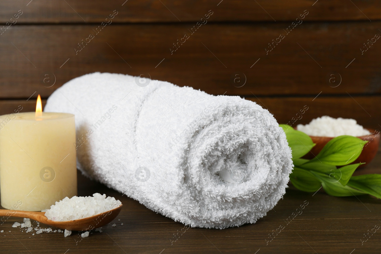 Photo of Composition with different spa supplies on wooden table, closeup