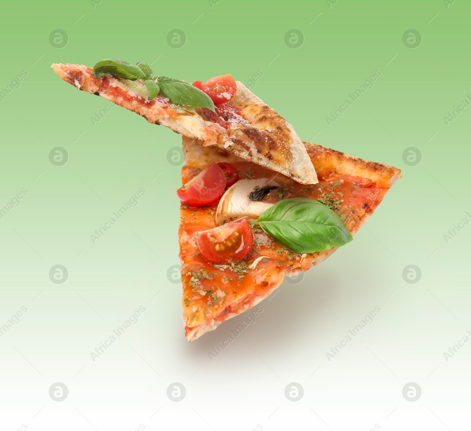 Image of Pizza slices in air on green gradient background