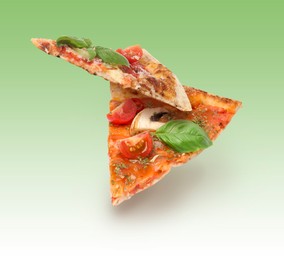 Pizza slices in air on green gradient background