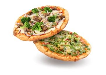 Image of Different pizzas in air on white background