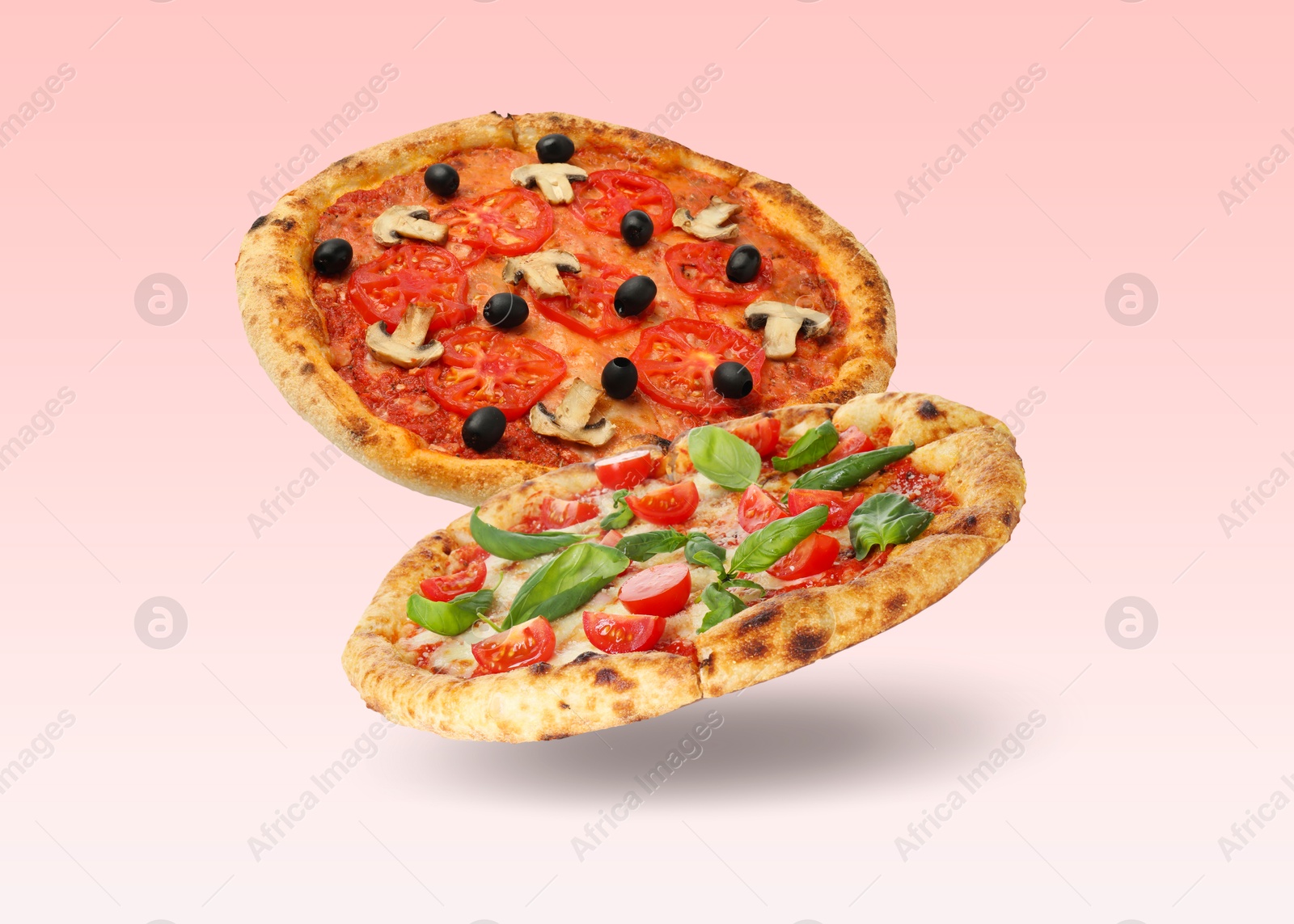 Image of Different pizzas in air on gradient background