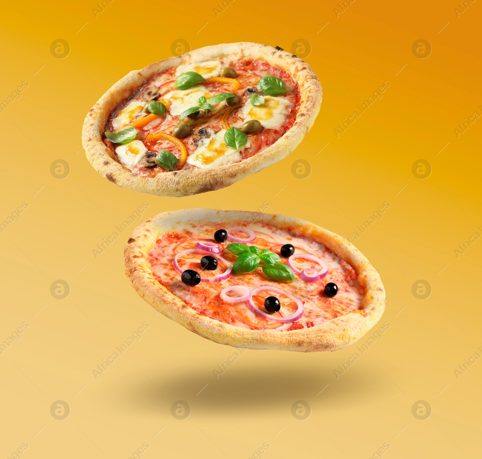 Image of Different pizzas in air on orange gradient background