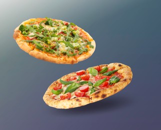 Image of Different pizzas in air on gradient background