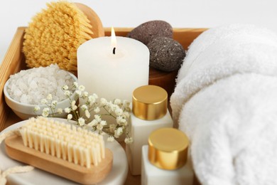 Photo of Different spa supplies on light background, closeup