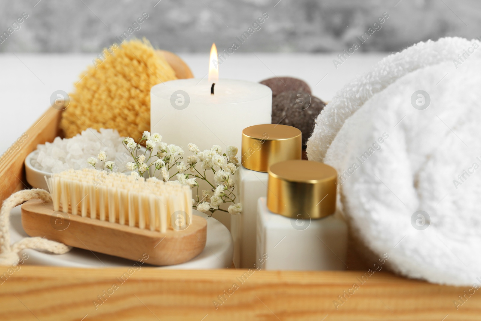 Photo of Different spa supplies on light background, closeup