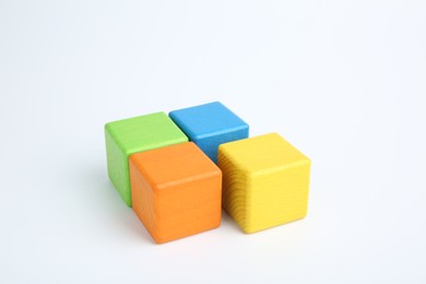 Photo of Many wooden colorful cubes on white background