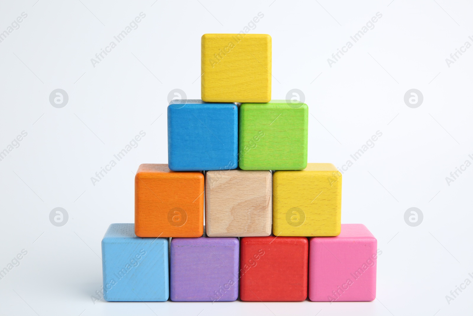 Photo of Pyramid of colorful cubes on white background