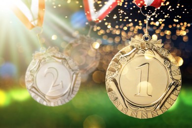 Image of Gold, silver and bronze medals at sports field