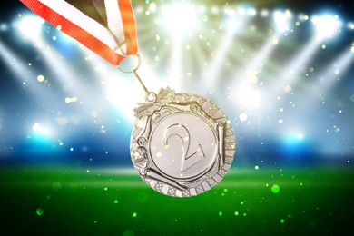 Second place silver medal at sports field, closeup