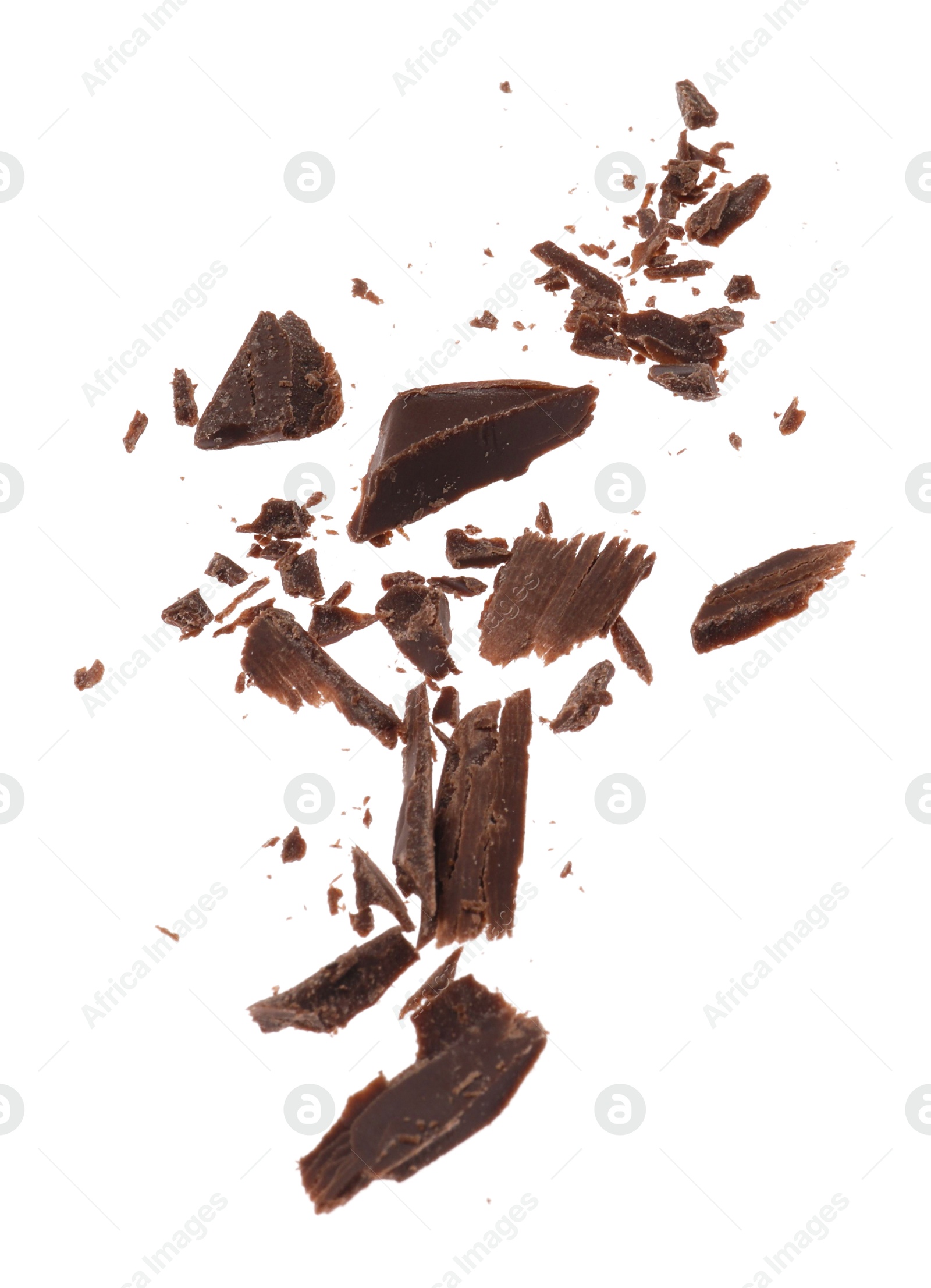 Photo of Many crushed chocolate pieces isolated on white