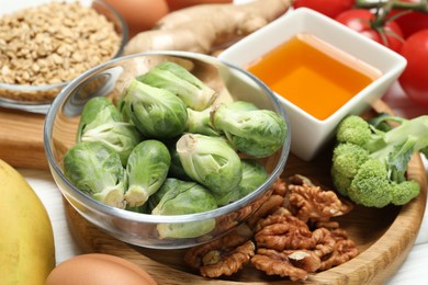 Photo of Different fresh products rich in melatonin on white table, closeup