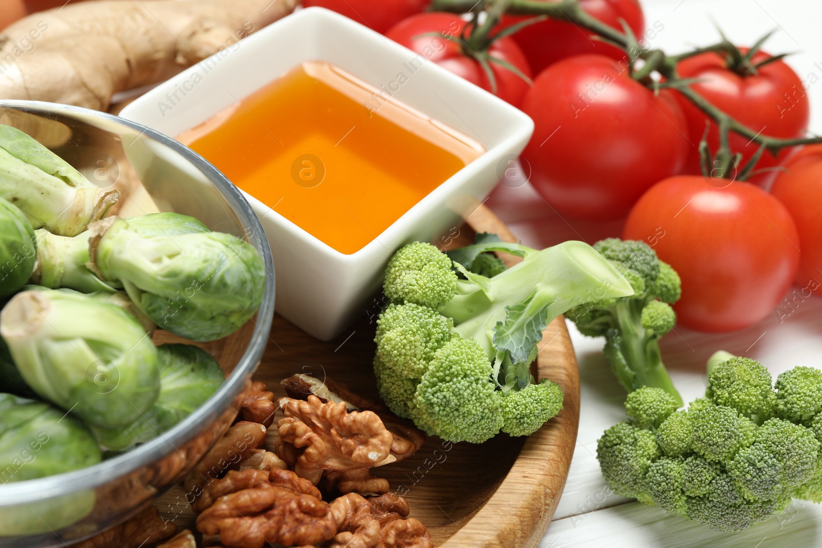 Photo of Different fresh products rich in melatonin on white table, closeup