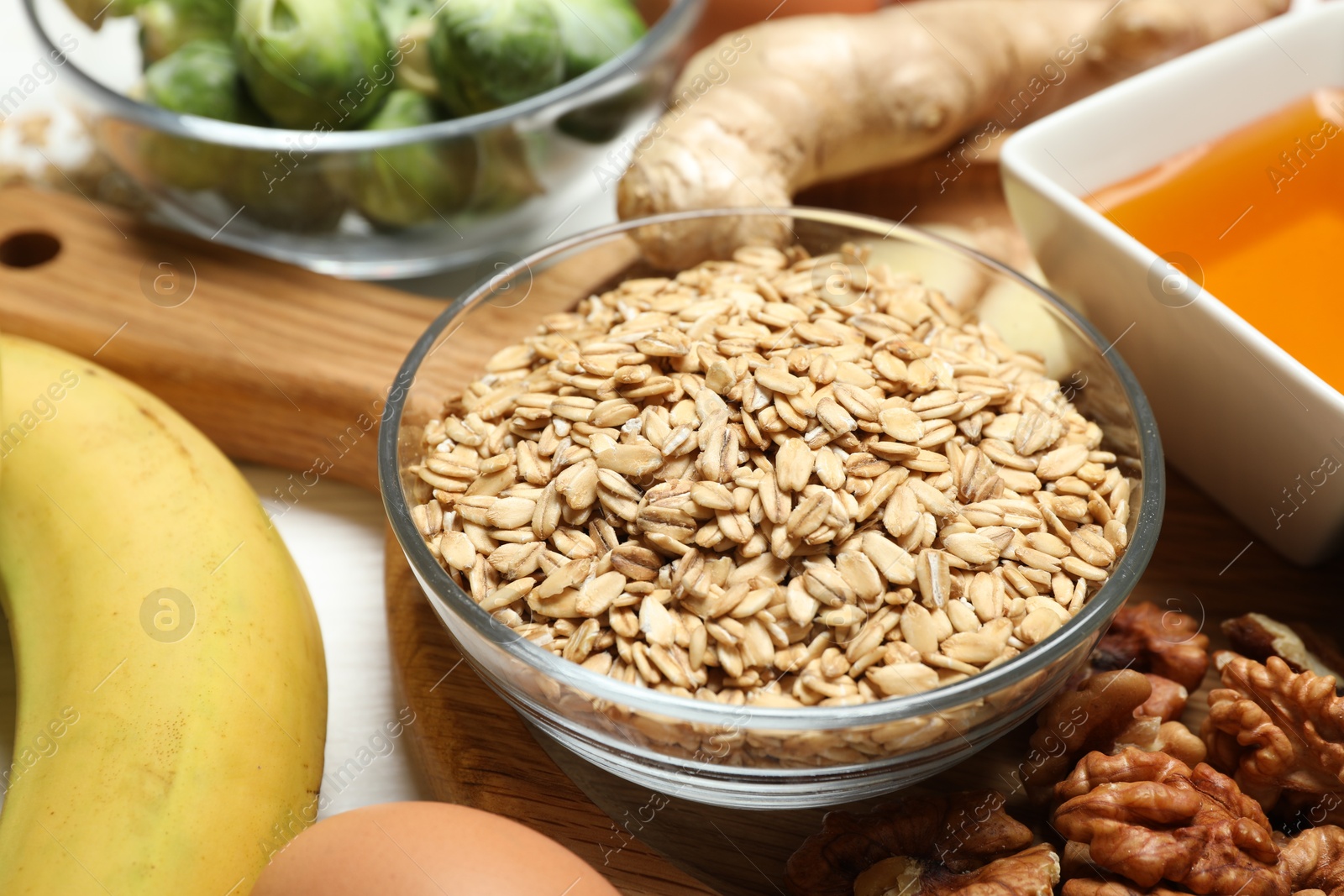 Photo of Different fresh products rich in melatonin on white table, closeup