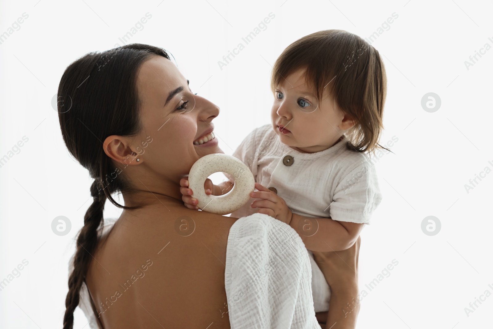 Photo of Beautiful young mother with her cute little baby indoors