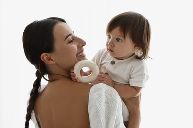 Beautiful young mother with her cute little baby indoors