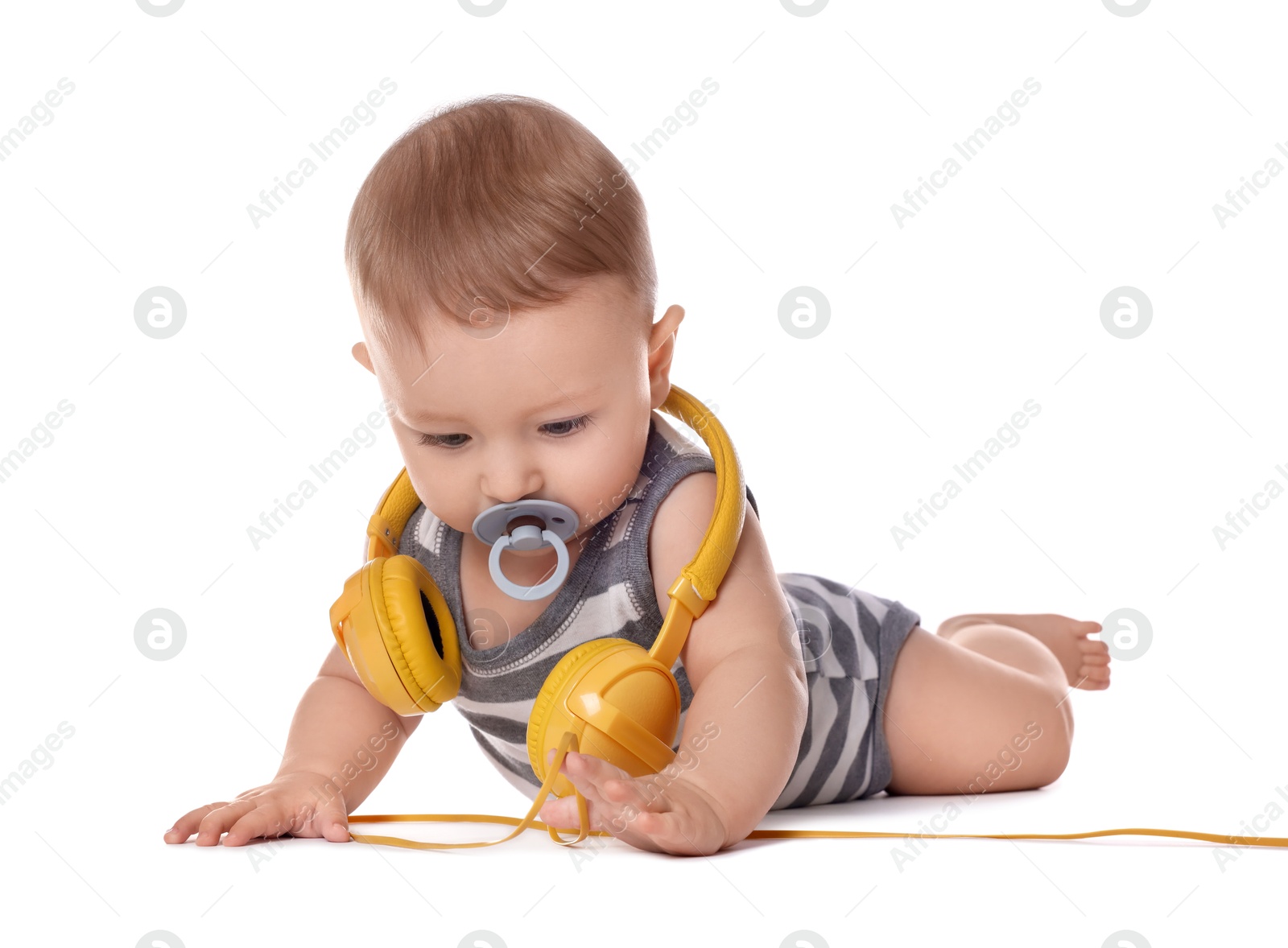 Photo of Cute little baby with pacifier and headphones on white background