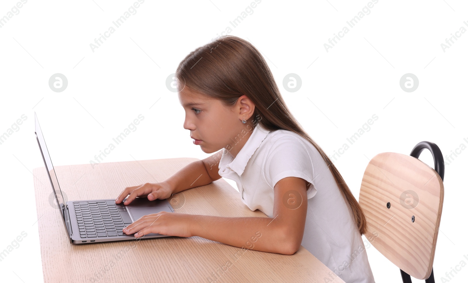 Photo of Girl with incorrect posture using laptop at wooden desk on white background