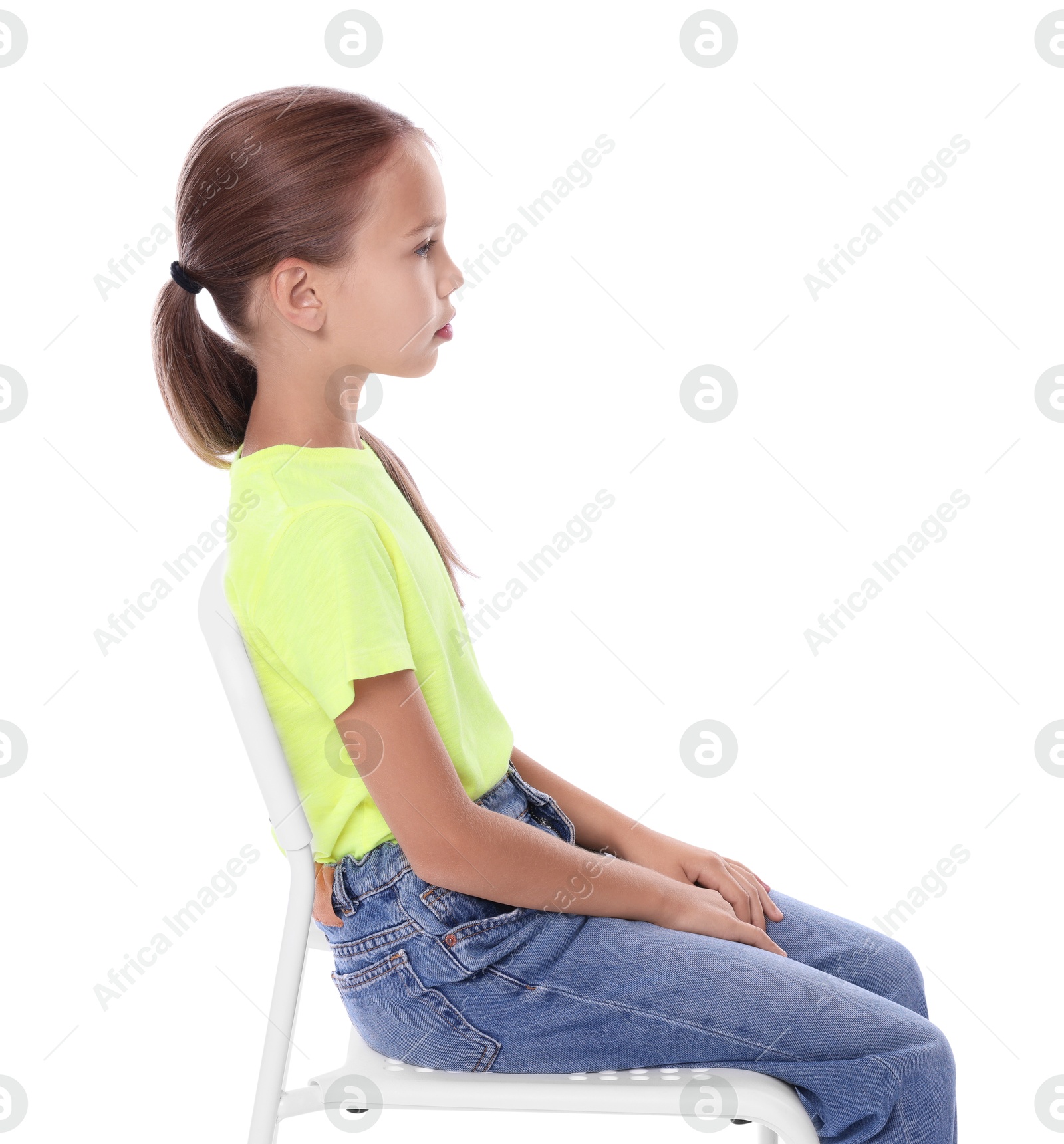 Photo of Girl with correct posture sitting on chair against white background