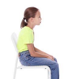 Photo of Girl with incorrect posture sitting on chair against white background