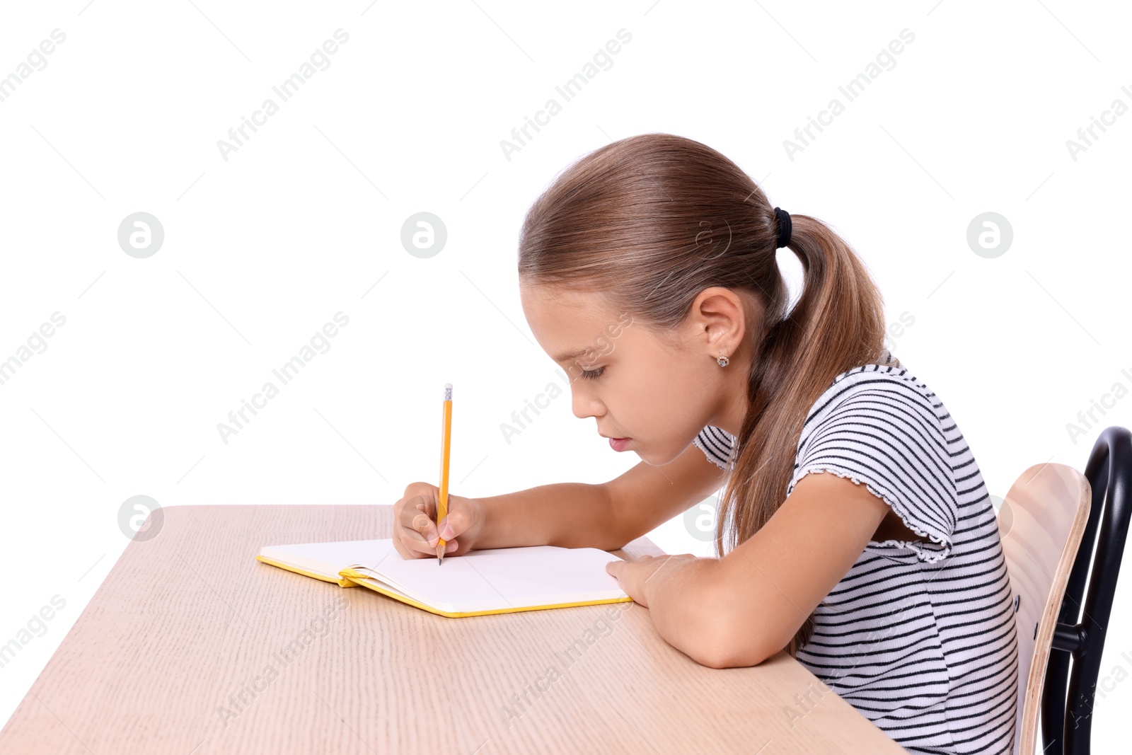 Photo of Girl with incorrect posture and notebook sitting at wooden desk on white background