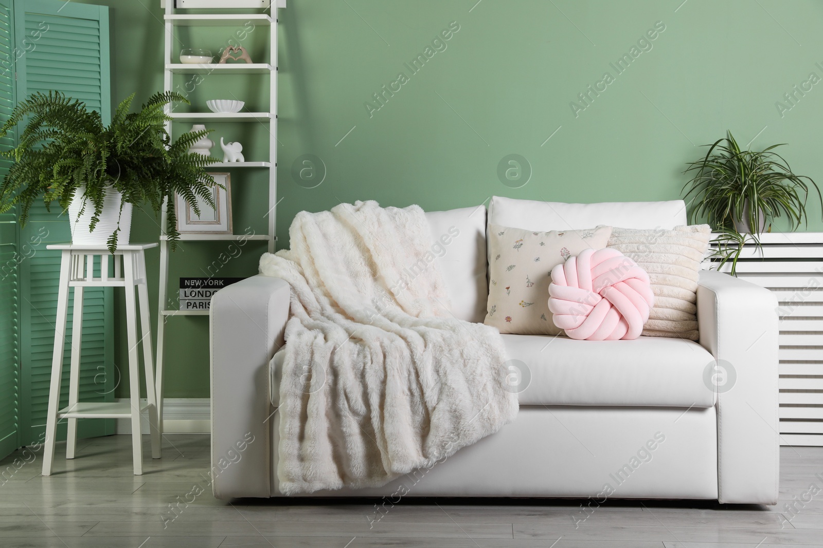 Photo of Beautiful living room interior with cozy sofa