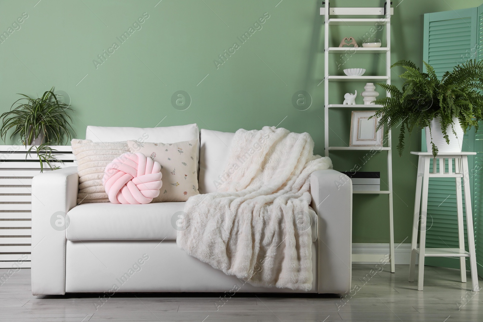 Photo of Beautiful living room interior with cozy sofa