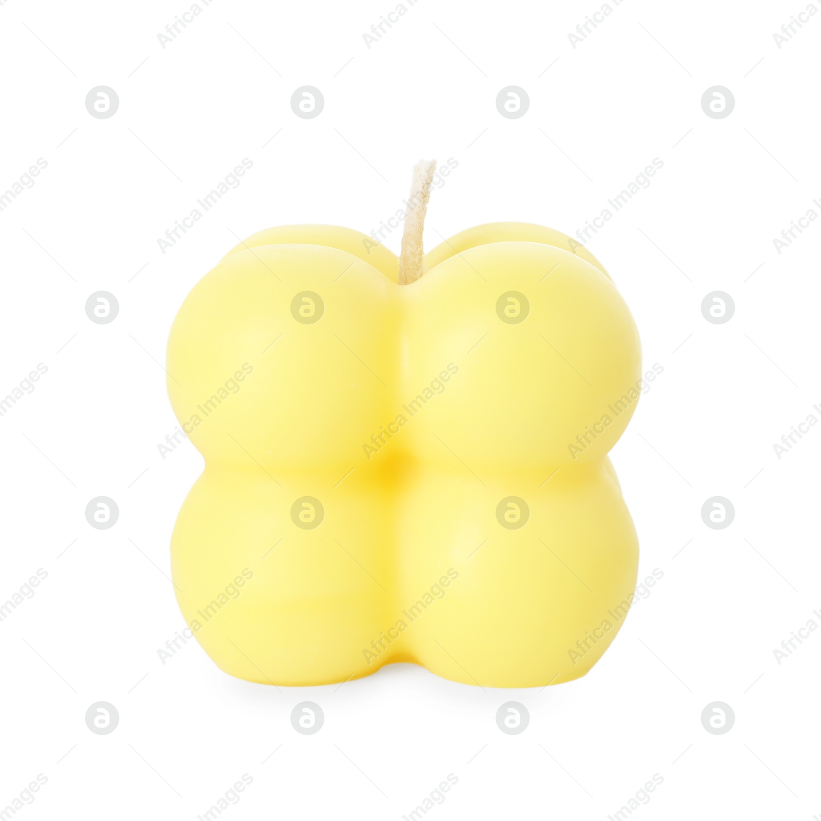 Photo of One yellow bubble candle isolated on white