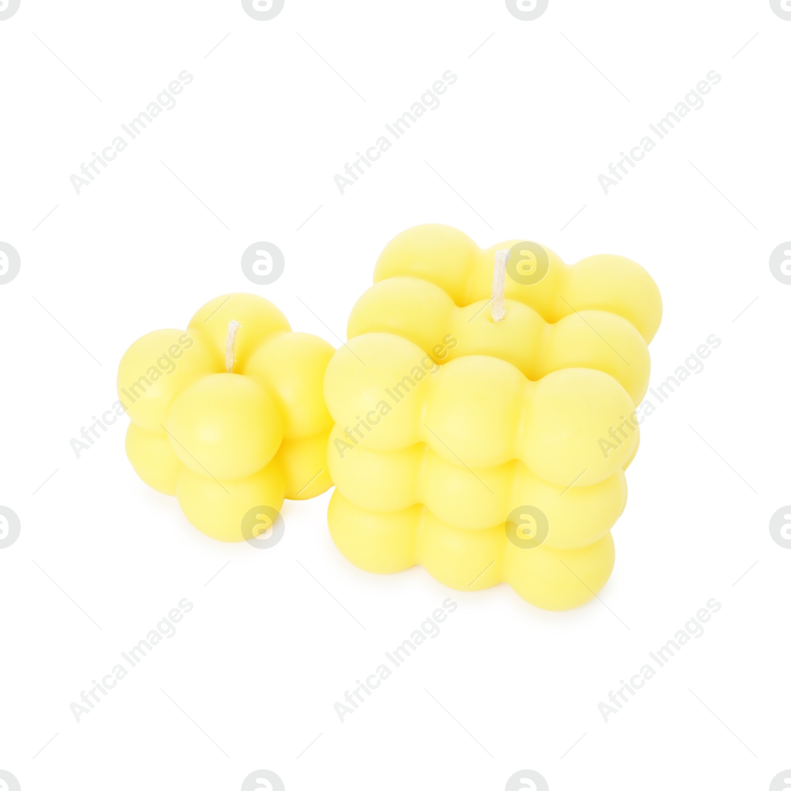 Photo of Two yellow bubble candles isolated on white