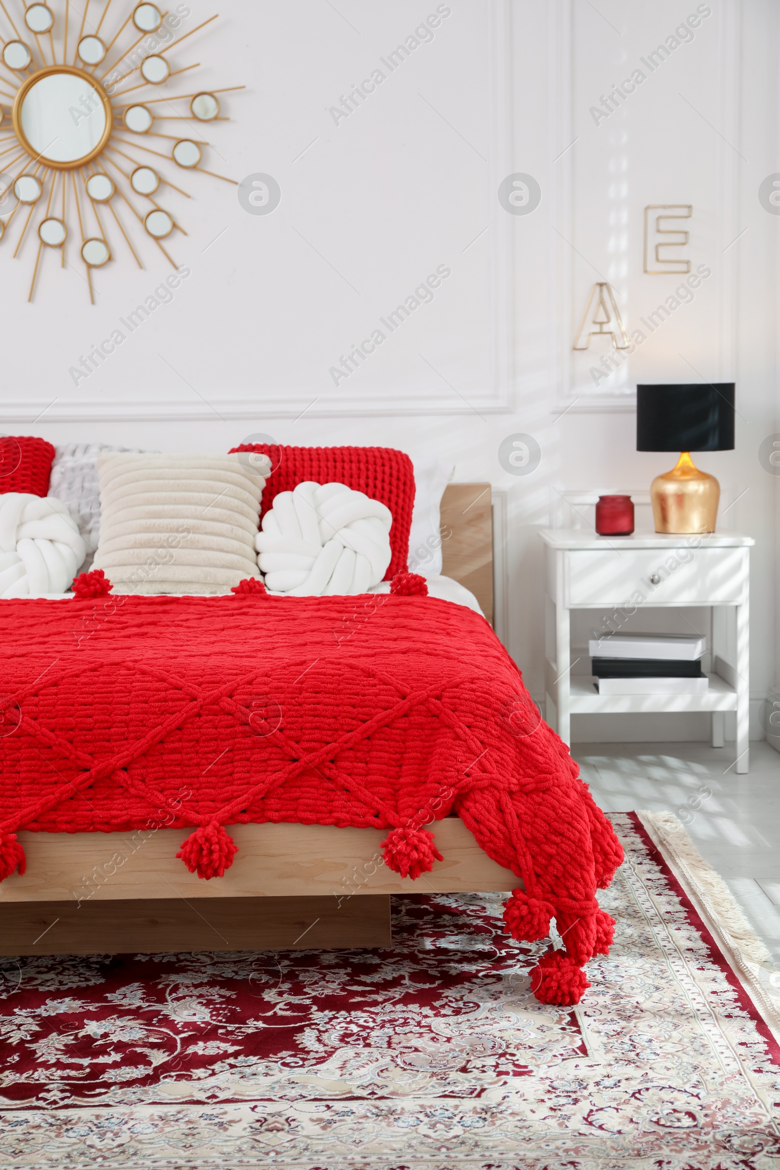 Photo of Big comfortable bed in room. Interior design